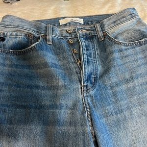 Boyfriend style blue jeans with distressed knees
